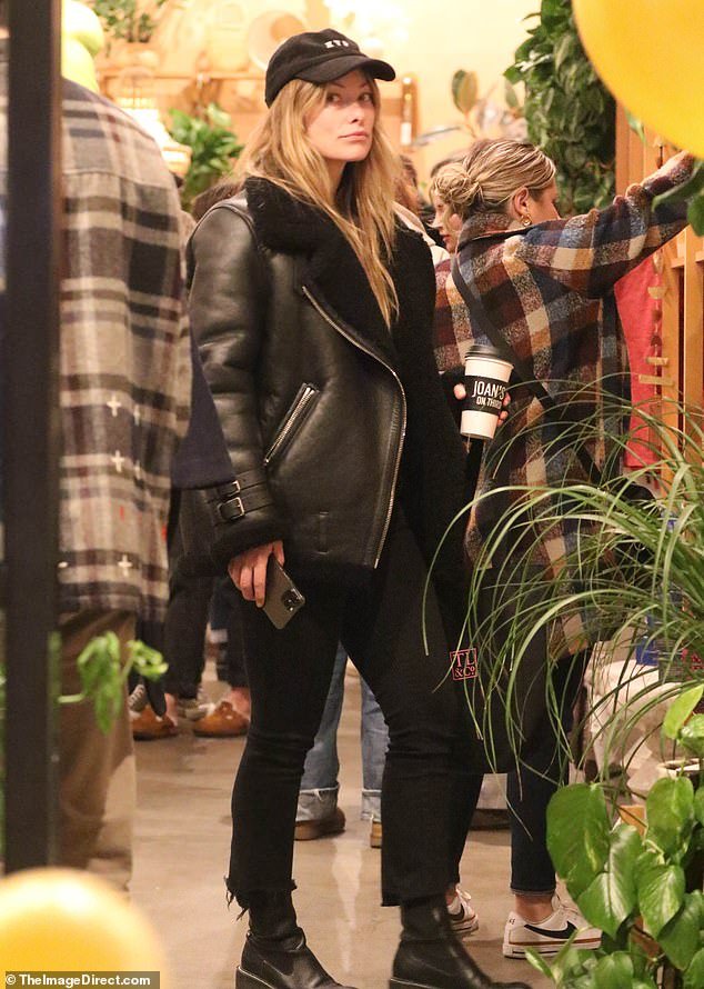 Olivia Wilde, dressed in black, enjoyed a night out with a close friend in Los Angeles on Thursday.  The actress appeared to enjoy her day of shopping at a night market in the Studio City neighborhood with her longtime boyfriend Jordan C Brown