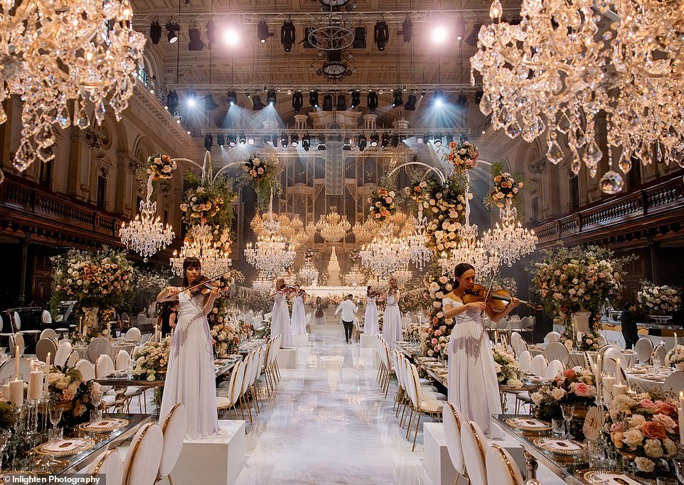 A young couple have given a glimpse into their dream wedding after organizing an extraordinary event with thousands of roses, 50 sparkling chandeliers, 400 guests and an extravagant multi-tiered cake