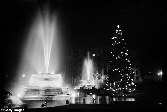 Fountains and the Christmas tree in Trafalgar Square, London, December 1948