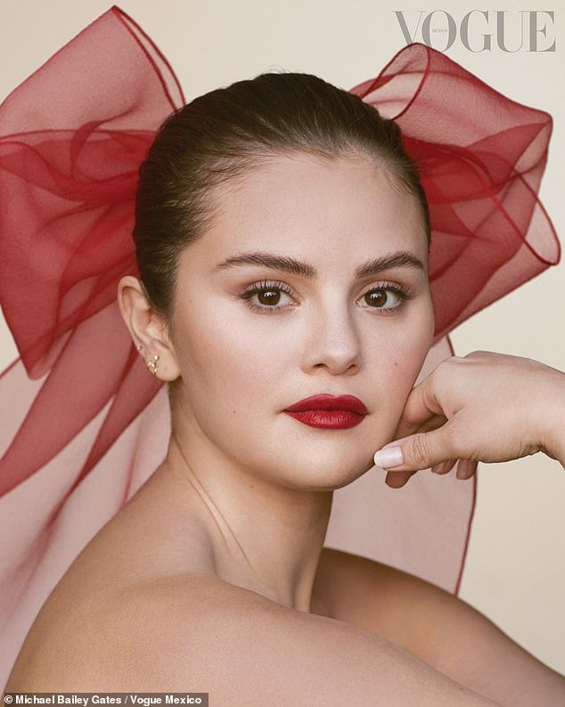 Finally, the Rare Beauty founder stunned in a close-up image as she stared at the camera with her hair slicked back and a large red bow on the back of her head.