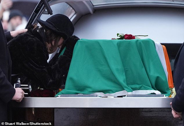 Earlier today, Mrs Clarke was pictured mourning as her late husband's coffin was carried into the church