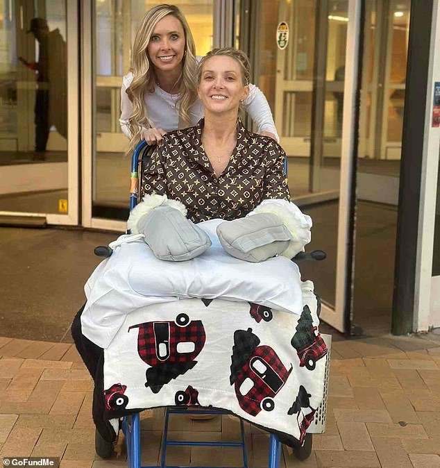 Lucinda Mullins, 41, a mother of two boys from Kentucky who underwent regular kidney stone surgery but ultimately lost both her legs and arms, smiles bravely despite being covered in bandages and confined to a wheelchair