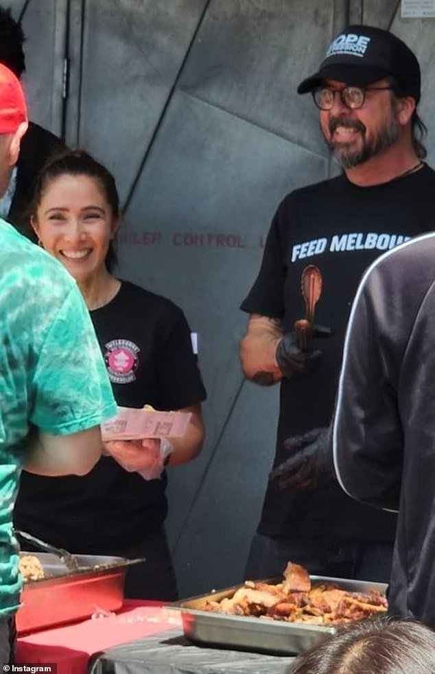 Grohl charmed his local fans on Friday when he took time out to volunteer for The Big Umbrella in Melbourne, a street kitchen charity for the homeless (pictured)