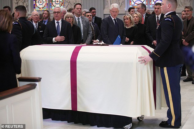 Representative Debbie Dingell (D-MI), former US President Bill Clinton and former Secretary of State Hillary Clinton attend the funeral service for former US Representative John Dingell at Holy Trinity Catholic Church in Washington, US, February 14, 2019