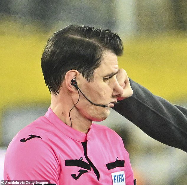 The moment when the fist of Faruk Koca, chairman of a top football club, makes contact with the face of referee Halil Umut Meler on Monday evening after a match in the Turkish Super Lig