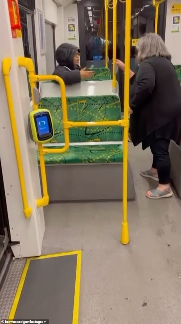 Mary (right) lectures a younger female passenger (left) for not having a valid myki card while traveling on a tram in Melbourne