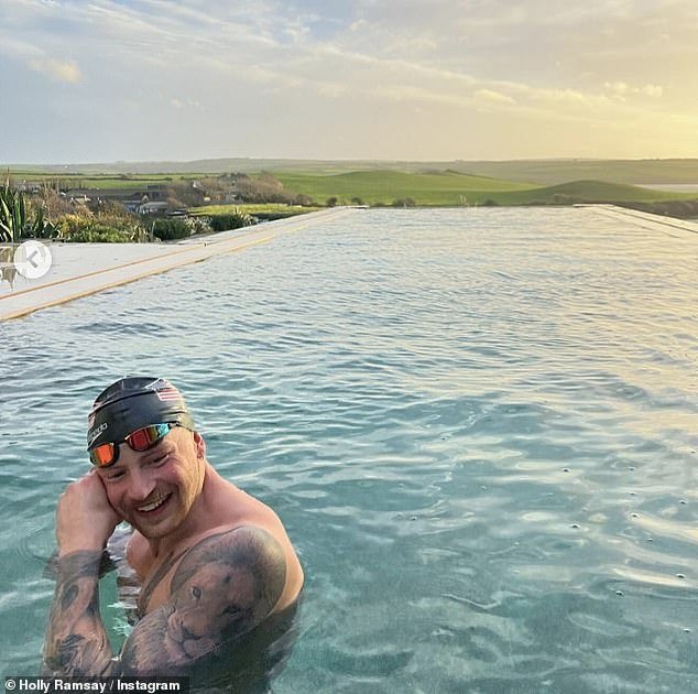 She also shared a photo of Olympic swimmer Adam smiling as he prepared to swim some laps in an outdoor pool