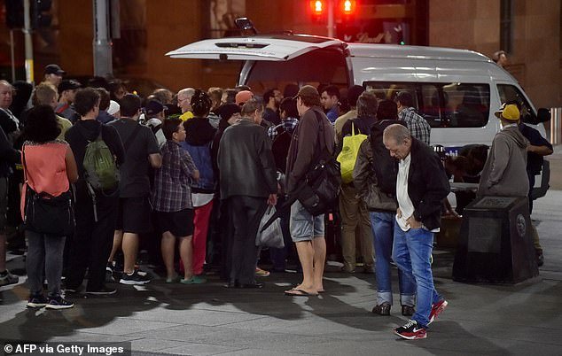 Food charities have reported a growing number of mortgage holders needing their services (pictured charity van feeding homeless people in Sydney)
