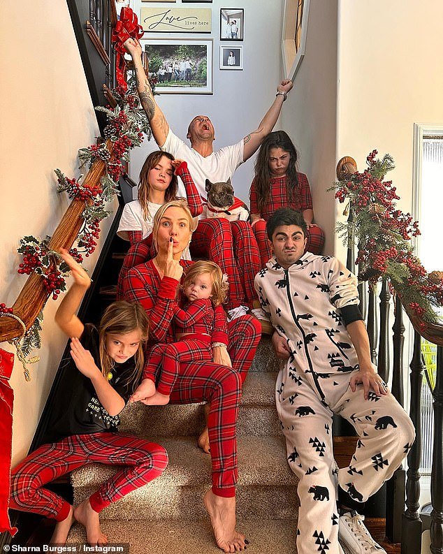 Burgess posted a family photo of himself with Green and all five of his children last Christmas Day