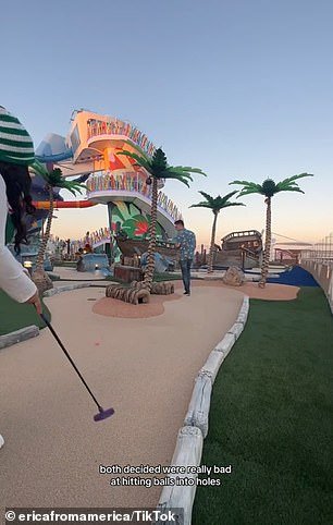 The cruise worker and influencer tested her mini-golf skills on the Lost Dunes course on the ship's upper deck