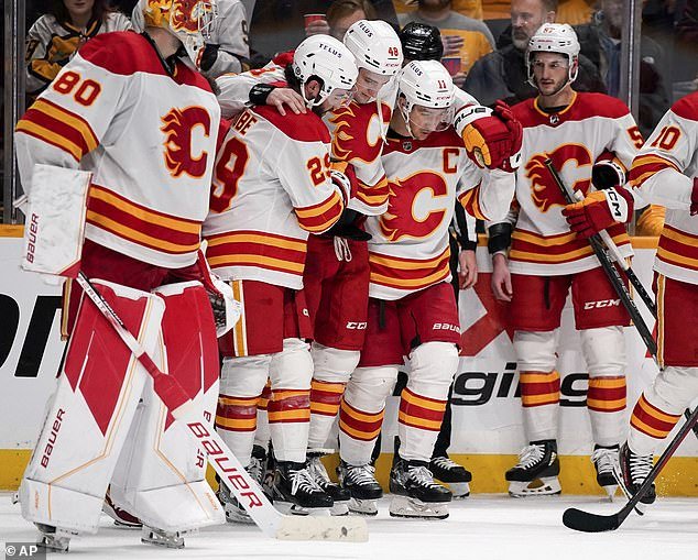 The defenseman had to be helped off the ice by his teammates during the Flames' win