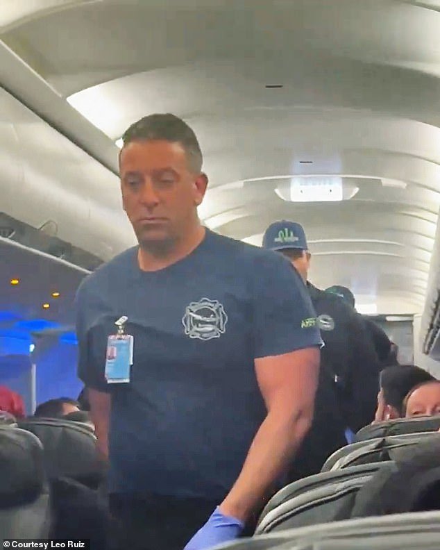 Firefighters boarded the plane in Orlando to escort the crazed customer off the plane