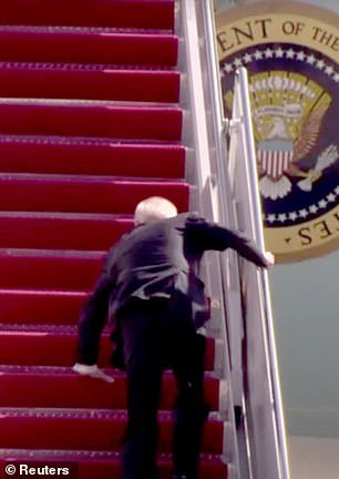 Biden stumbles as he runs up the stairs of Air Force One