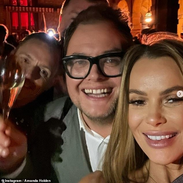 Amanda rang in the new year in style on Sunday as she joined her best friend Alan Carr for a wild party at Estelle Manor