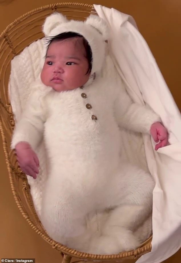 Amora was seen in photos and behind-the-scenes videos wearing a charming, fluffy white onesie with bear ears