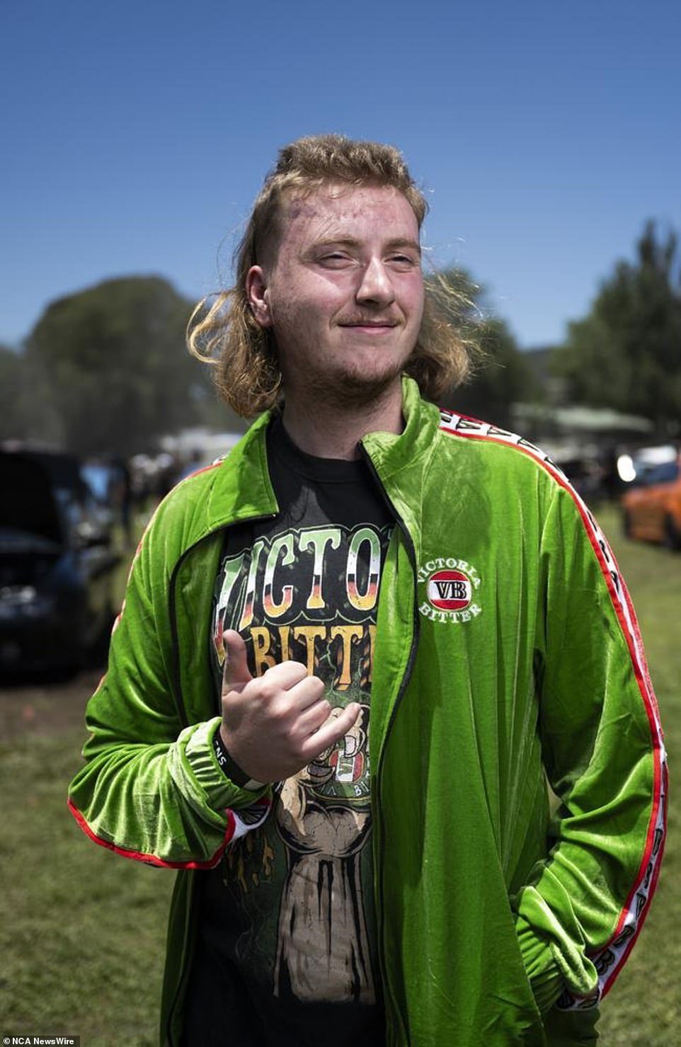 A festival goer shows off his mullet at Summernats in Canberra, where hundreds of thousands of people are expected to attend the event