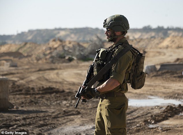 An Israeli soldier exits a tunnel that Hamas reportedly used to attack Israel through the Erez border crossing on January 7, 2024 in northern Gaza