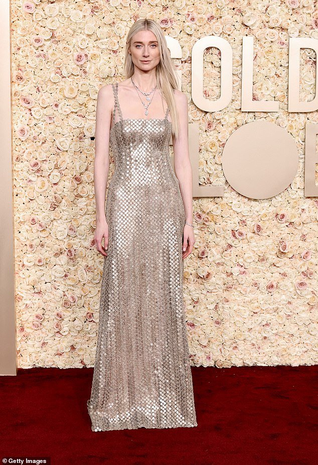 The blonde beauty fittingly wore a gold chain mail dress for the exciting evening