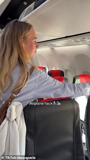 Before she sat down on her Norwegian Airlines flight, she turned the headrest covers of the seats in front of her so that they hung down in the back and faced her.