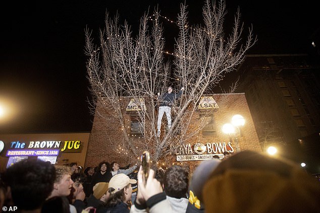 Supporters poured into the streets of Ann Arbor and even climbed trees in Michigan