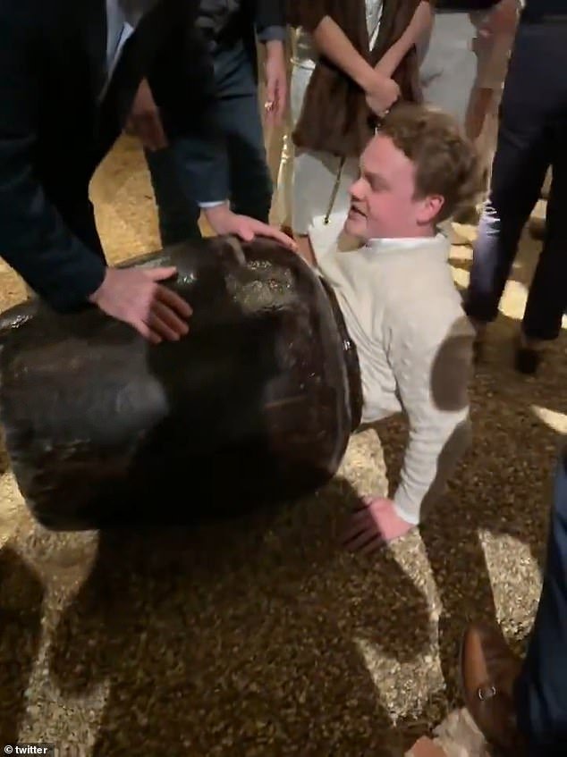 Connor Padgett of Birmingham, Alabama, somehow ended up with half his body in the big brown vase at a party in Mountain Brook