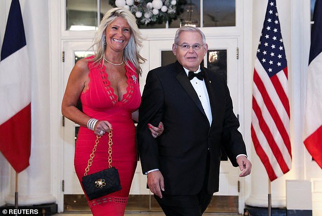 Senator Bob Menendez (D-NJ) and his wife Nadine Arslanian arrive for a state dinner honoring French President Emmanuel Macron at the White House in December 2022;  the couple has been charged with three crimes related to bribery and extortion
