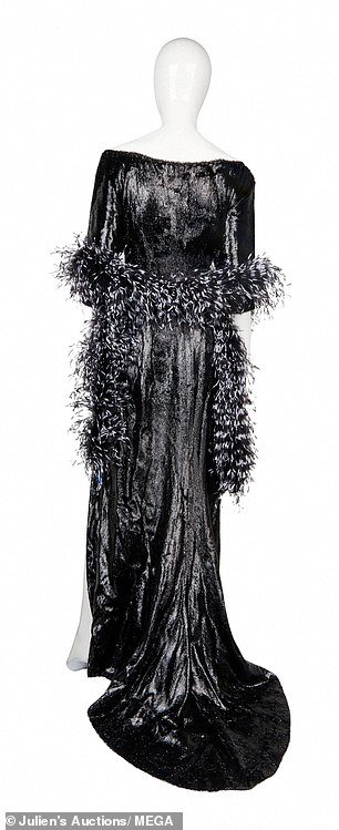 The garment includes a black and white feather boa that, according to the auction house, 'was not in the original film'