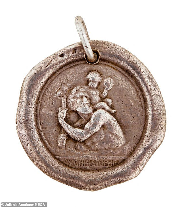 A religious medal of Saint Christopher, once owned by Monroe, is among the items in the lot