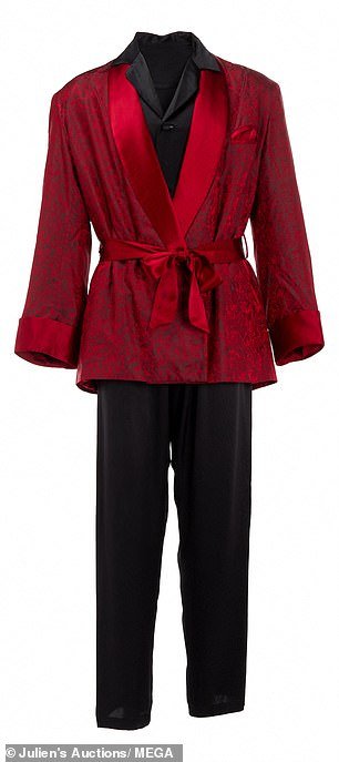 Among the items in the auction associated with the late Playboy founder Hugh Hefner is a full ensemble of a classic smoking jacket, silk pajamas, slippers and a pipe that Hefner wore.