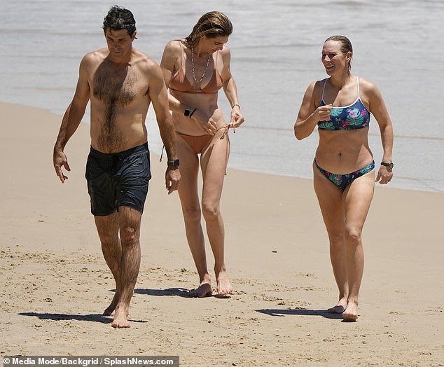 She was joined by her cousin Harry's best friend Nacho and his wife Delfina on the idyllic beach