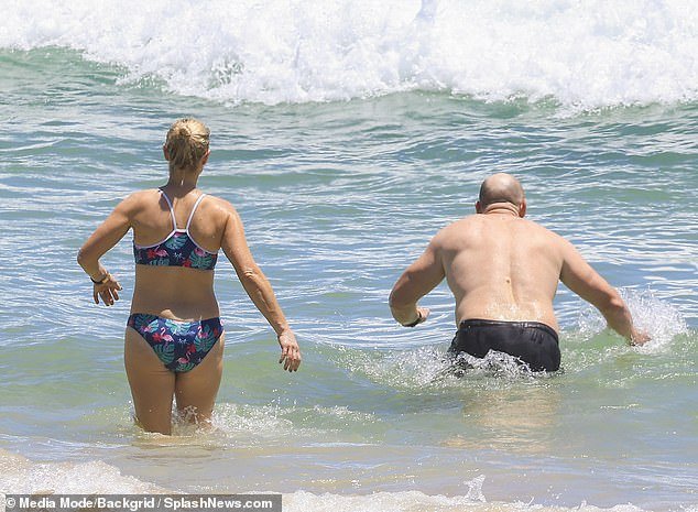 The mother-of-three and Olympian splashed around in the water with her rugby pro husband
