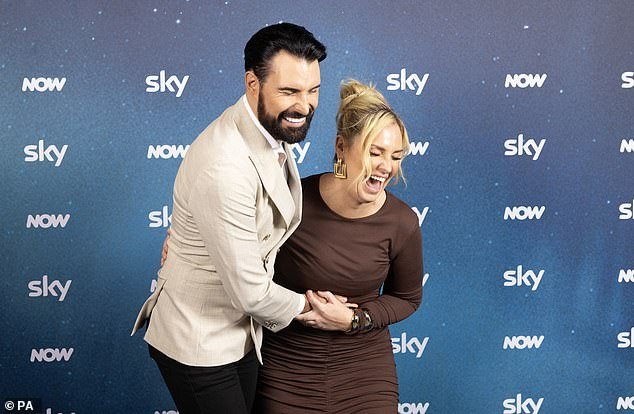 Presenter Rylan, 35, looked dapper in a beige jacket and crisp white shirt as he posed with the ladies