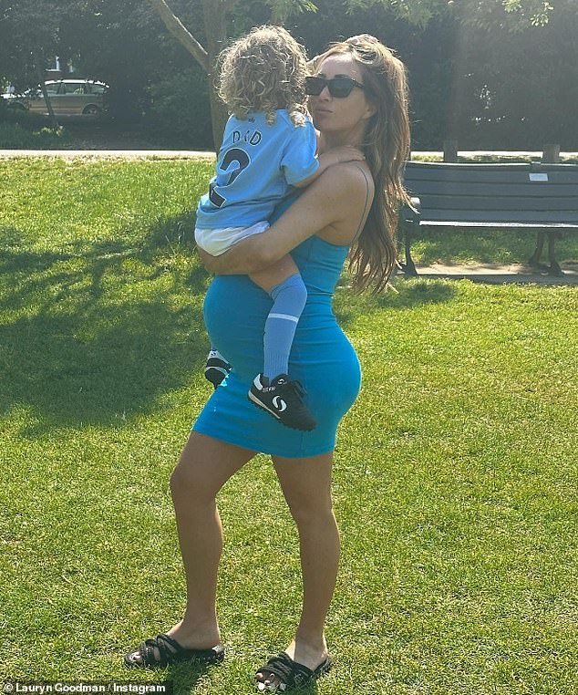 The Manchester City defender has been rumored to be the biological father since the reality star gave birth to the toddler in August, who she claimed to have welcomed with 'another footballer' (Lauryn pictured with son Kairo)