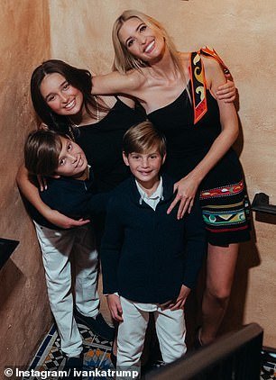 Ivanka smiles as a loving mother poses with her three children