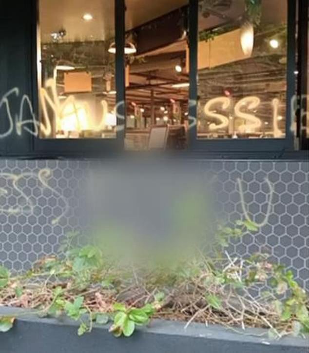 The offensive graffiti also urged Australians to boycott the supermarket giant after it announced it would not be selling Australia Day merchandise