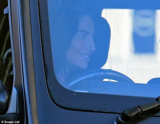 Smiling Annie was pictured behind the wheel of her black luxury Mercedes 4x4 in Cheshire on Monday, putting on a brave face