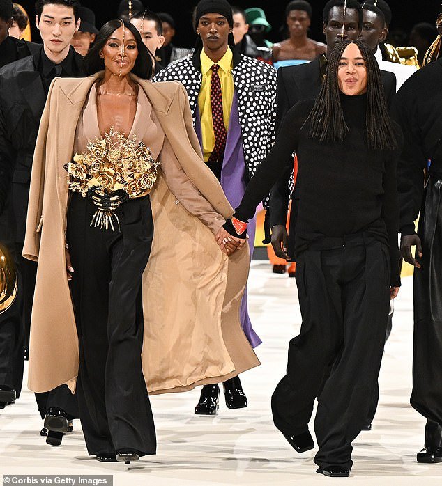 Naomi smiled hugely as she took her final walk down the runway