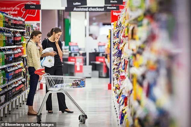 Since the end of the Covid-19 lockdowns, prices have risen for everything from rents to the weekly grocery shop.  Two women are seen looking at prices in a supermarket