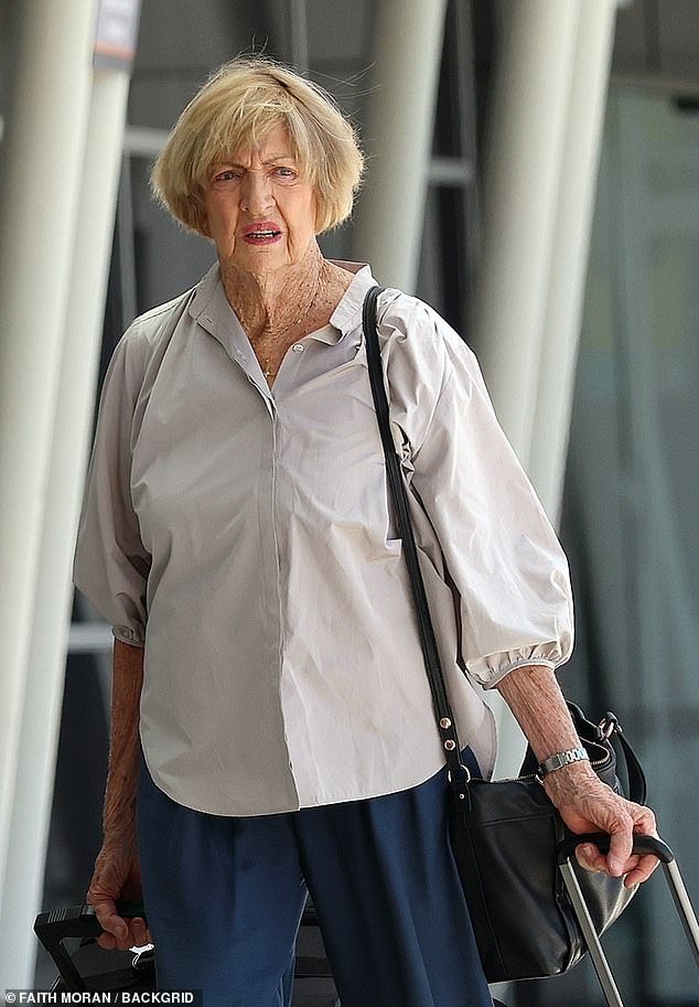 Margaret Court looked dejected as she arrived at Perth Airport on Monday to fly to Melbourne