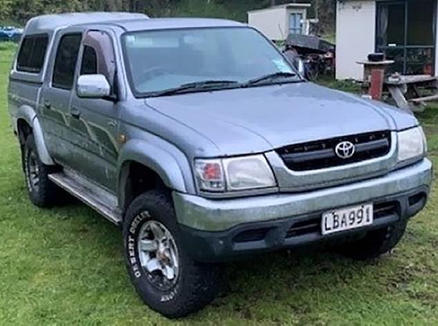 Mr Phillips' gray Toyota Hilux (pictured) was discovered abandoned in the surf at Kiritehere Beach (pictured below) in September 2021 before he and the three children reappeared 18 days later