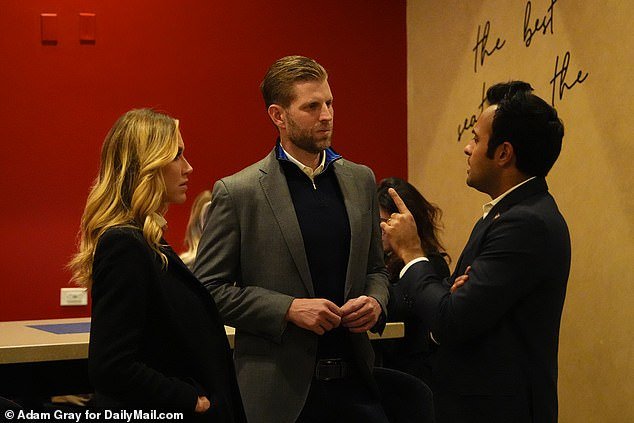 Eric Trump and Lara Trump talk with Vivek Ramaswamy as they wait for the New Hampshire results