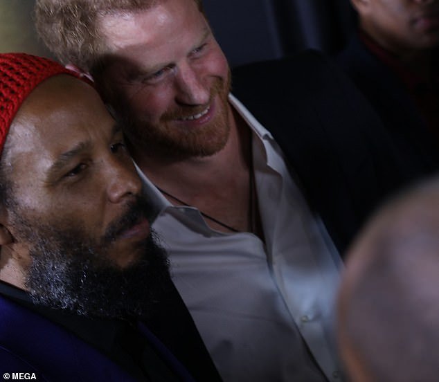 Harry is seen with Ziggy Marley, the son of Bob and Rita Marley, at the premiere in Kingston