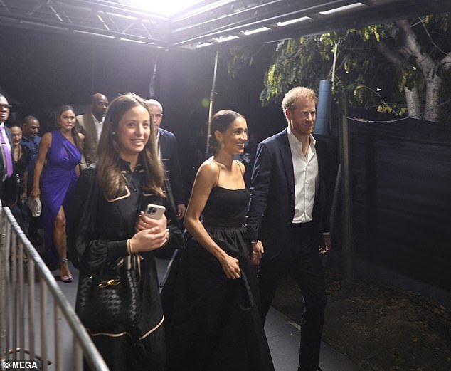 Harry and Meghan are pictured arriving at the premiere.  The film premieres on February 14