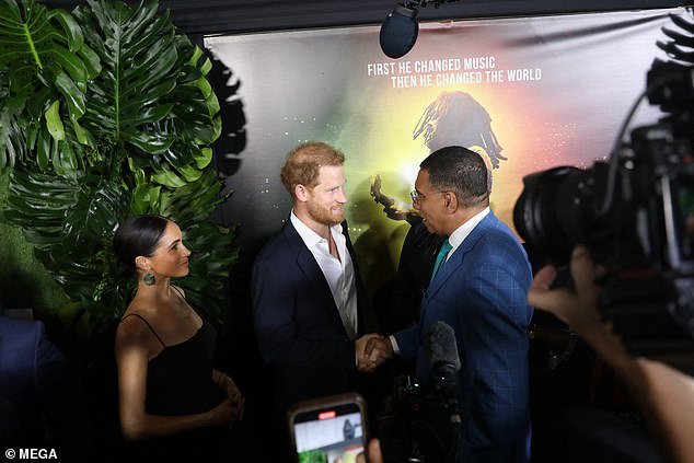 Harry, 39, shakes hands with Jamaica's Prime Minister Andrew Holness
