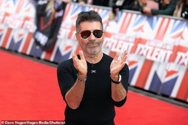 Cowell was in a light-hearted mood as he applauded fans outside the central London venue