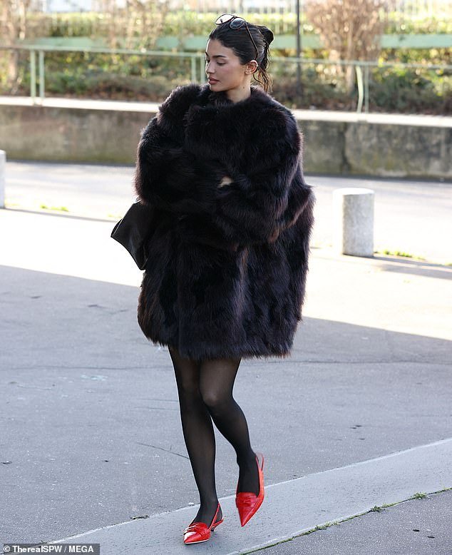 Kylie Jenner Turns Up The Glam Wearing A Faux Fur Coat And Vibrant Red ...