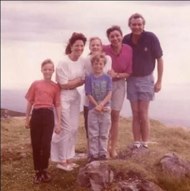 Jamie pictured with his late mother and their family
