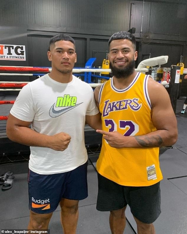 Leapai (pictured with Brisbane Broncos star Payne Haas) will make his professional debut in Adelaide on a card that will also feature some of the AFL's big names