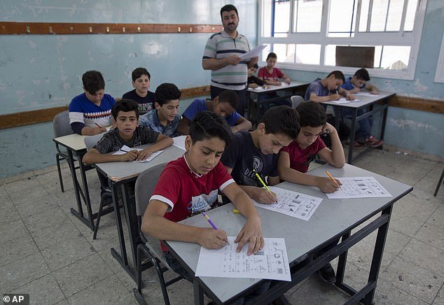The UN agency for Palestinians, known as UNRWA, provides aid and education to Palestinians in Gaza and the West Bank, such as this school in Hebron