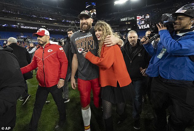 Swift is seen with boyfriend Travis Kelce on Sunday as Kelce's team qualified for the Super Bowl